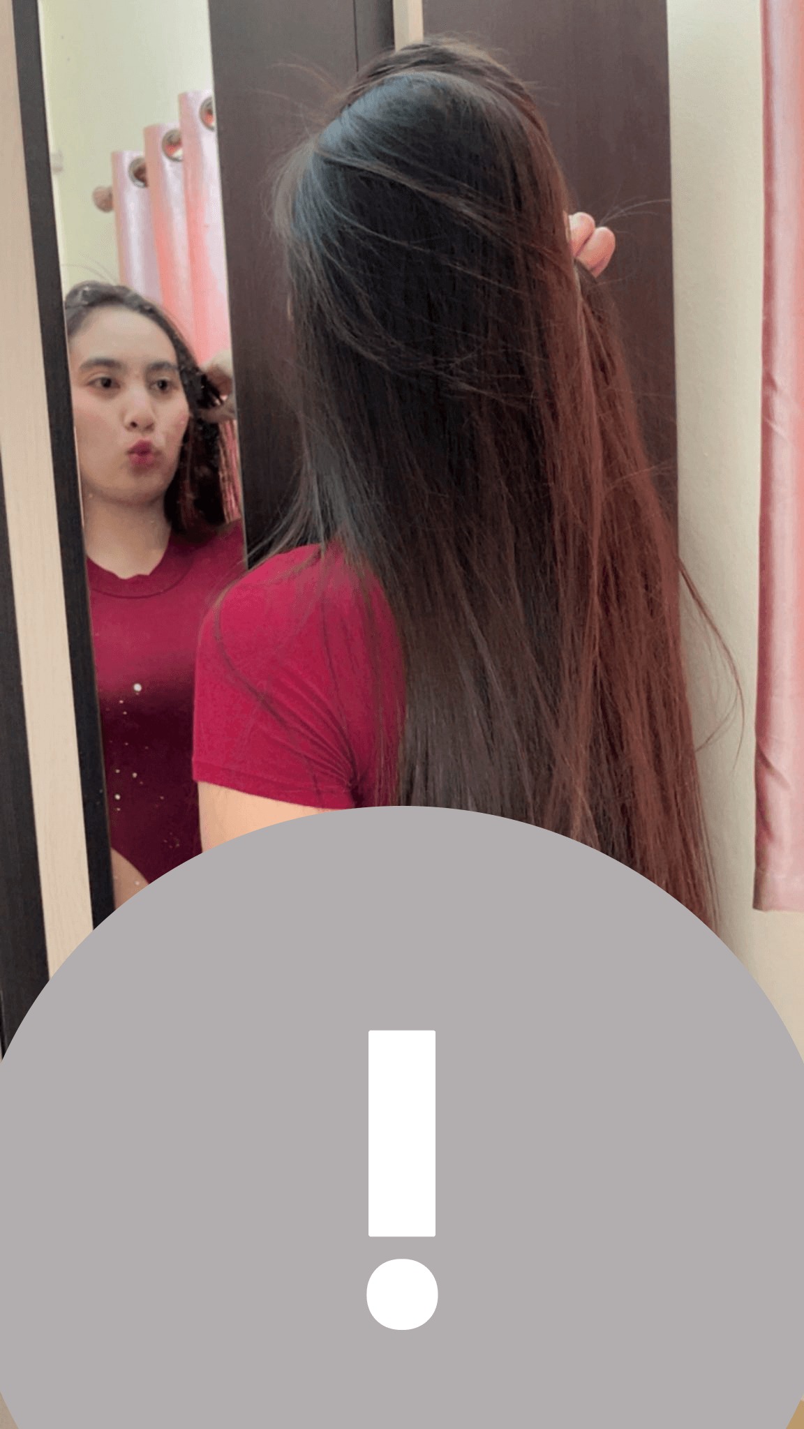 May be an image of one or more people, phone and text