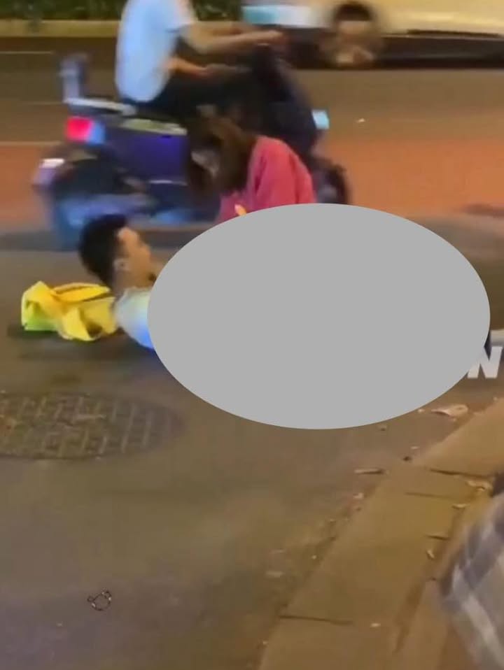 May be an image of one or more people, slow loris, scooter and street