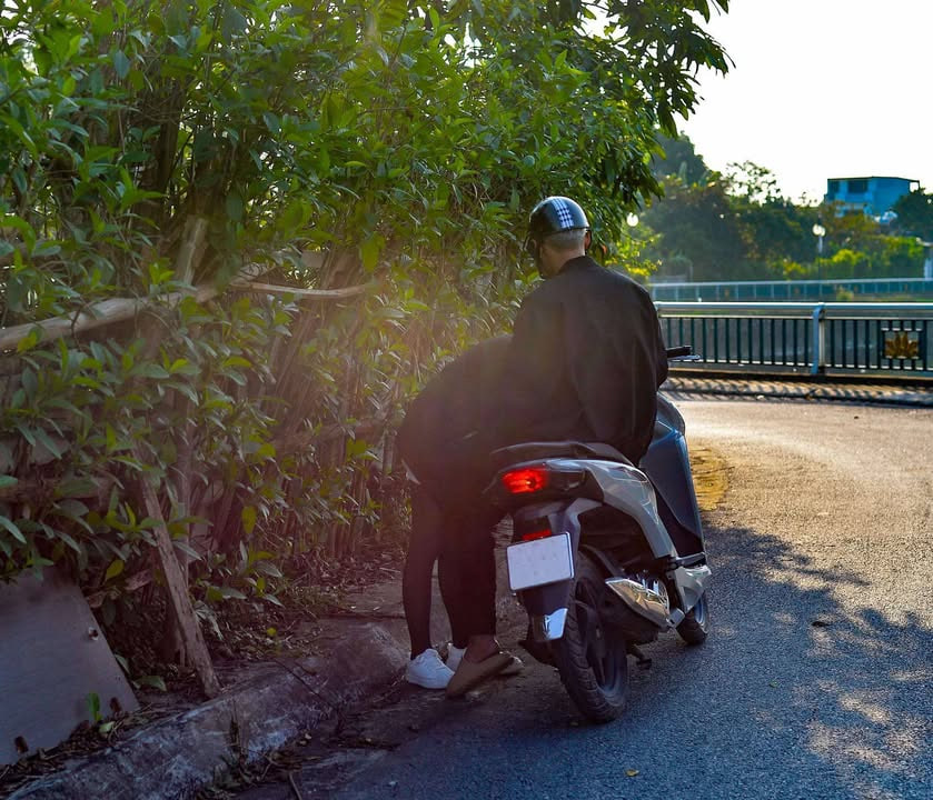 May be an image of scooter, motorcycle, road and street