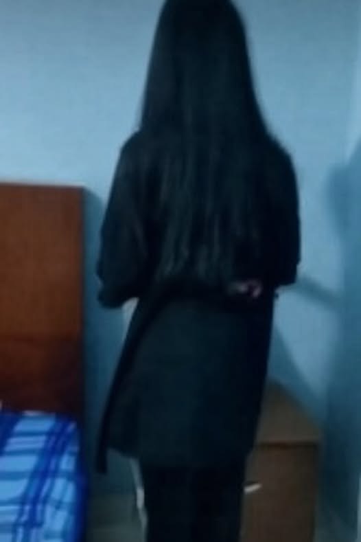 May be an image of overcoat