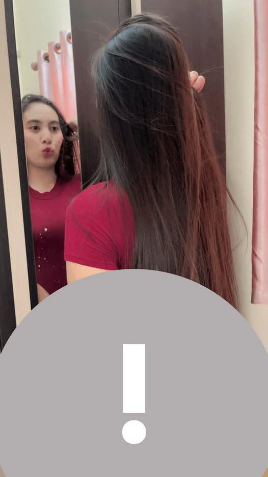 May be an image of one or more people, phone and text