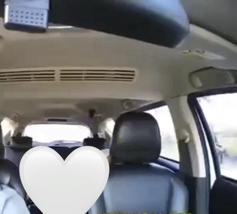 May be an image of rearview mirror and car