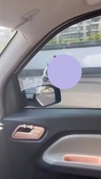 May be an image of rearview mirror and car